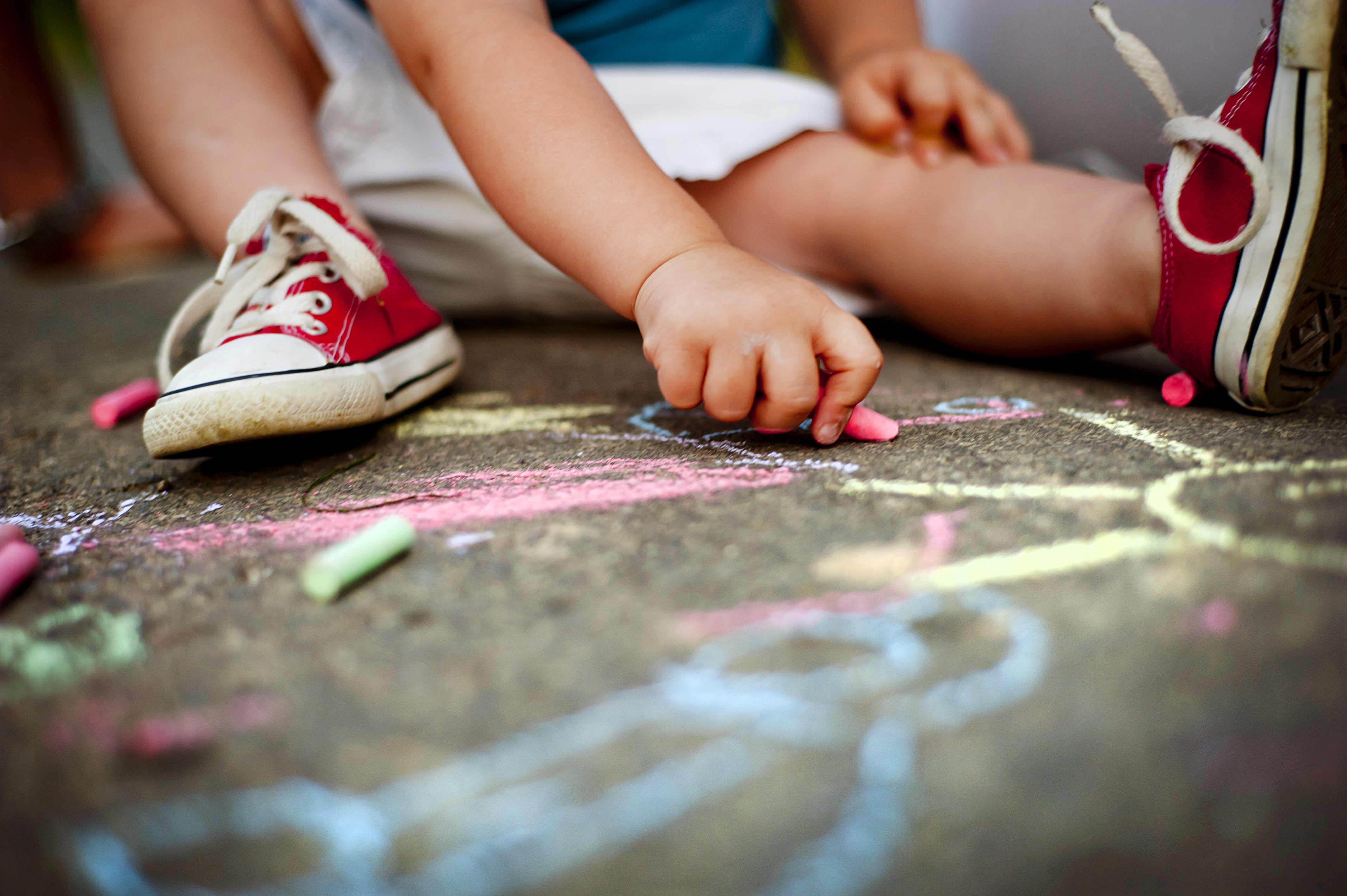 graphicstock-close-up-of-little-boy-in-canvas-shoes-drawing-with-chalks-on-the-sidewalk_SATdiG2bZ.jpg